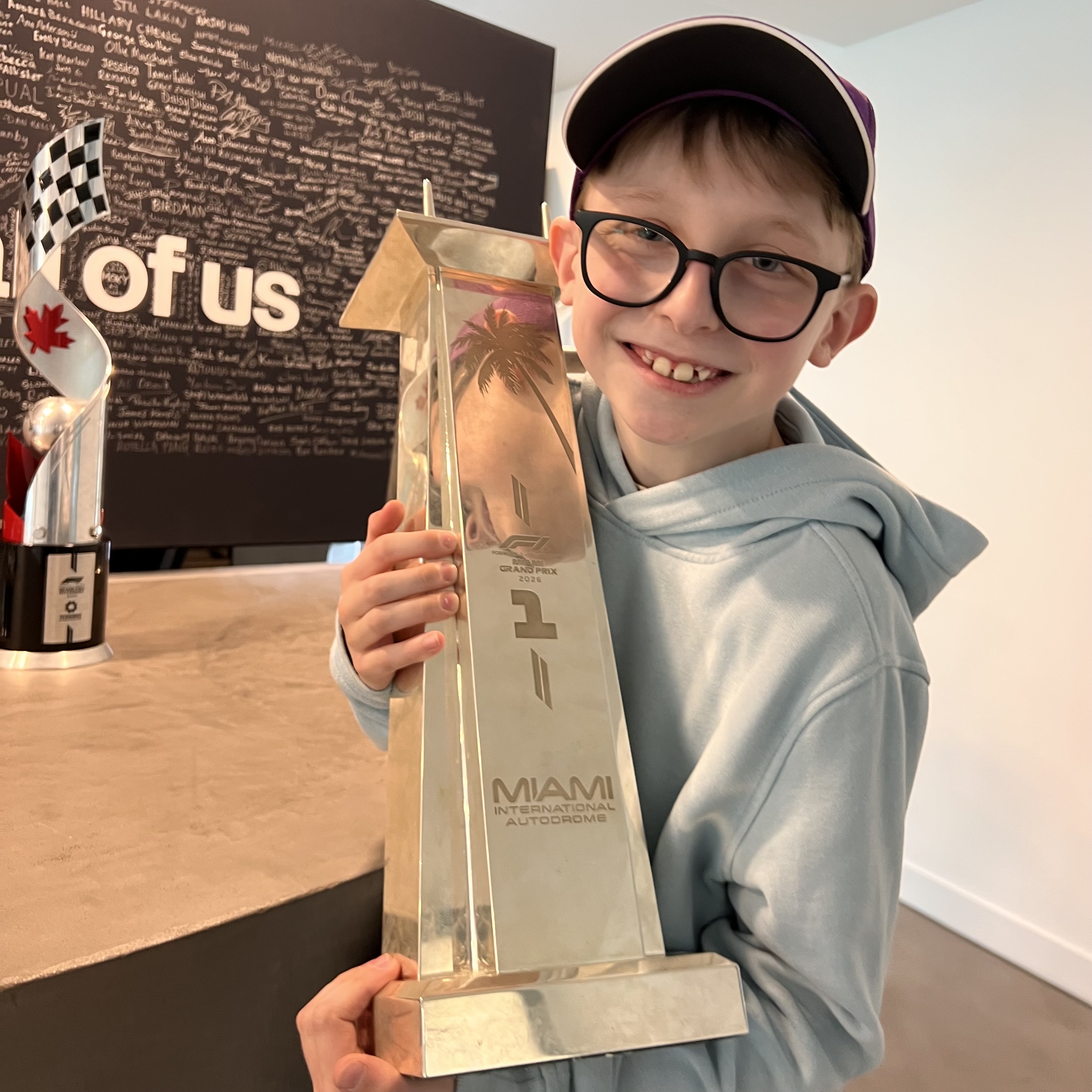 Ethan holding the same Miami Grand Prix trophy